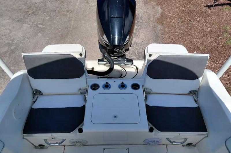 Slide: The Image of 2020 Bayliner Trophy T20CC boat interior with seating and motor view. - 22