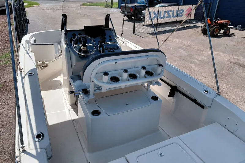 Slide: The Image of 2020 Bayliner Trophy T20CC boat interior with steering console and seating. - 30
