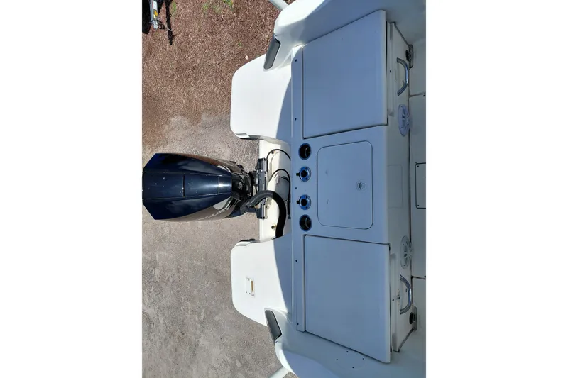 Slide: The Image of 2020 Bayliner Trophy T20CC boat with outboard motor and storage compartments. - 25