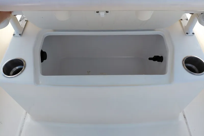 Slide: The Image of 2020 Bayliner Trophy T20CC boat storage compartment with cup holders. - 34