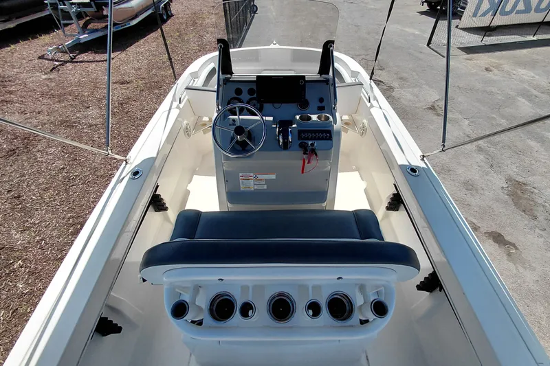 Slide: The Image of 2020 Bayliner Trophy T20CC boat cockpit with steering wheel and control panel. - 36