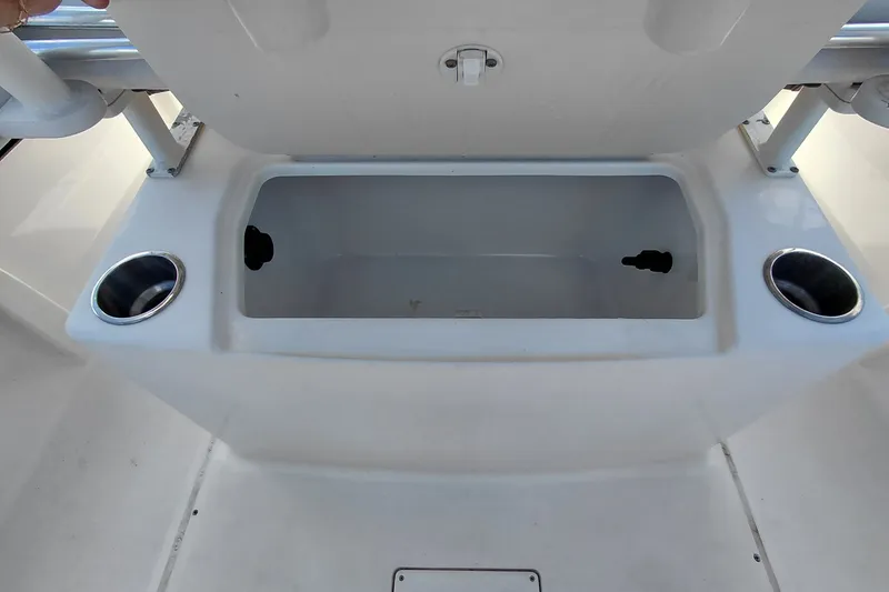 Slide: The Image of 2020 Bayliner Trophy T20CC boat storage compartment with cup holders. - 33