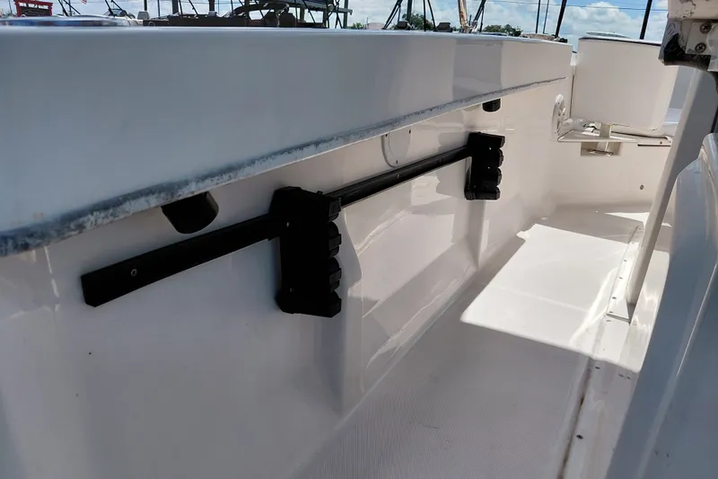 Slide: The Image of 2020 Bayliner Trophy T20CC interior showing rod holders and seating area. - 38