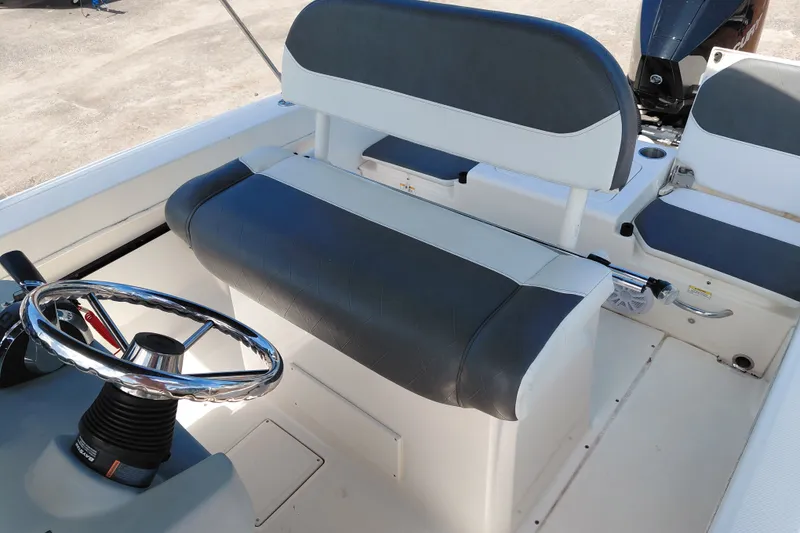Slide: The Image of 2020 Bayliner Trophy T20CC boat interior with steering wheel and seating. - 20