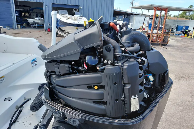 Slide: The Image of 2020 Bayliner Trophy T20CC boat engine in a marine workshop setting. - 40