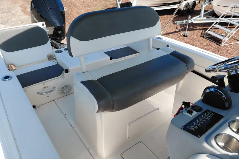 Slide: The Image of 2020 Bayliner Trophy T20CC boat interior with seating and control panel. - 21