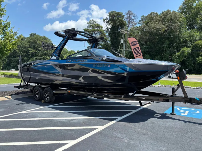 Slide: The Image of The image shows a 2023 Centurion Fi25 boat on a trailer in a parking lot. - 3