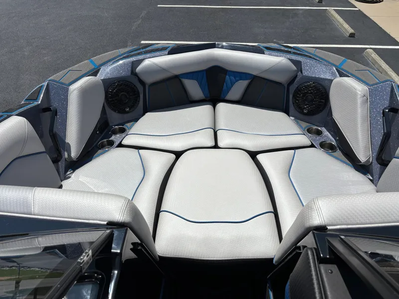 Slide: The Image of The image shows the bow of a 2023 Centurion Fi25 with luxurious white upholstery. - 9