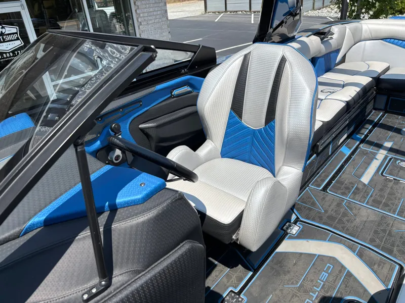 Slide: The Image of The image shows the cockpit of a 2023 Centurion Fi25 with blue and gray accents. - 11