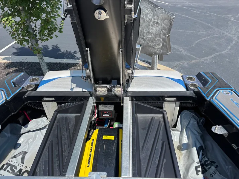 Slide: The Image of The image shows the engine compartment of a 2023 Centurion Fi25 with the lid open. - 14
