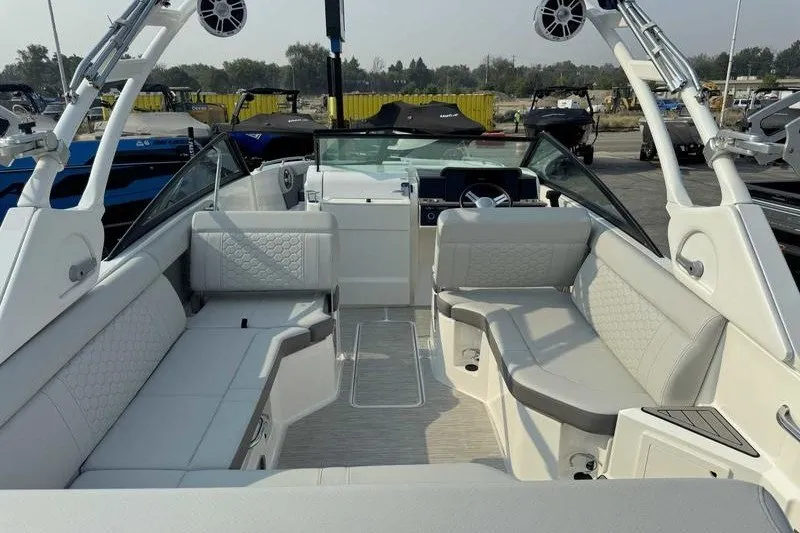 Slide: The Image of 2022 Sea Ray SDX 250 boat interior with spacious seating and modern design. - 1