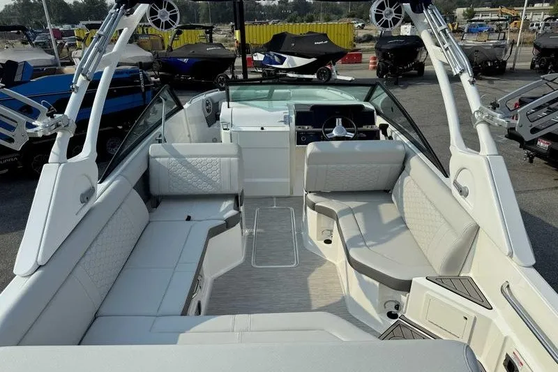 Slide: The Image of 2022 Sea Ray SDX 250 boat interior with spacious seating and modern design. - 9
