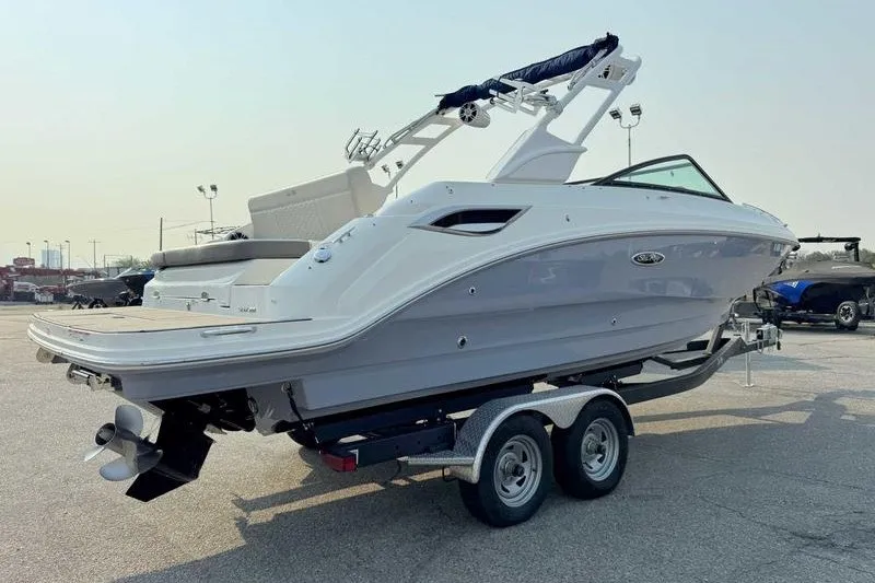 Slide: The Image of 2022 Sea Ray SDX 250 boat on trailer, parked outdoors. - 11