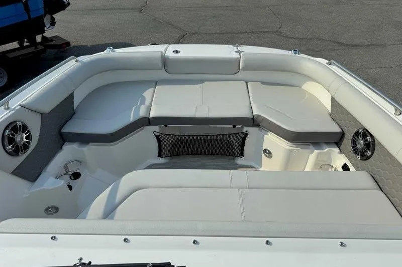 Slide: The Image of 2022 Sea Ray SDX 250 boat interior with cushioned seating and speakers. - 3