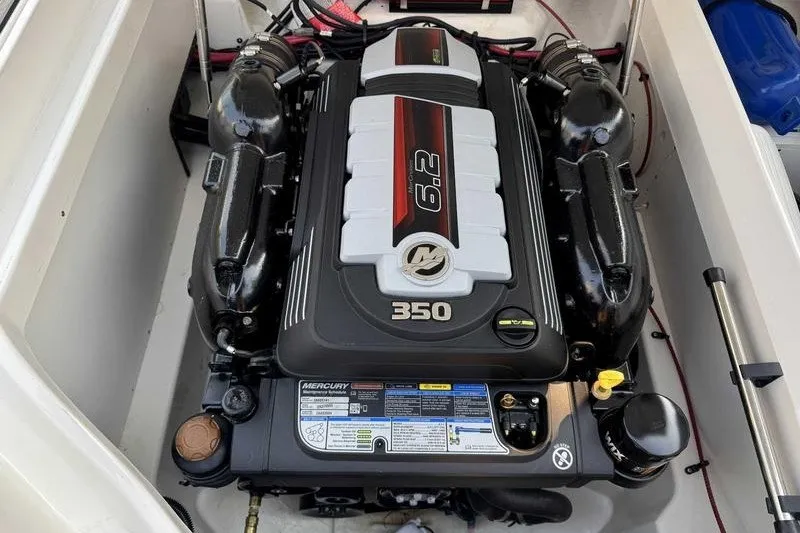 Slide: The Image of 2022 Sea Ray SDX 250 engine compartment featuring a Mercury 6.2L 350 HP engine. - 6