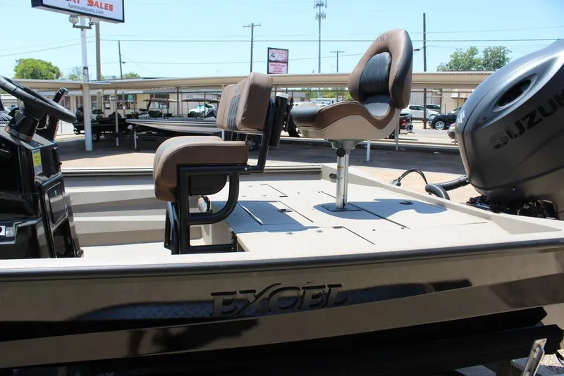 Slide: The Image of 2027 Excel 220 Bay Pro Elite boat with Suzuki engine and comfortable seating. - 10