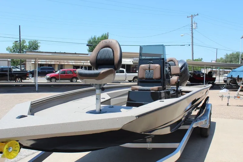 Slide: The Image of 2027 Excel 220 Bay Pro Elite boat on trailer, featuring sleek design and comfortable seating. - 14