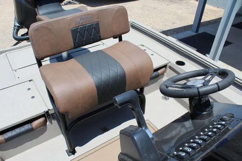 Slide: The Image of Captain's seat and steering console of 2027 Excel 220 Bay Pro Elite boat. - 13
