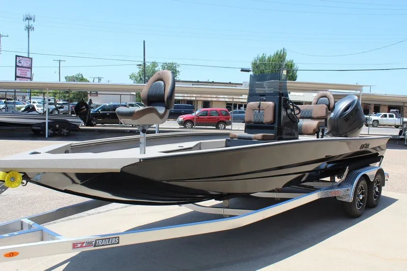 Slide: The Image of 2027 Excel 220 Bay Pro Elite boat on trailer, featuring sleek design and comfortable seating. - 12