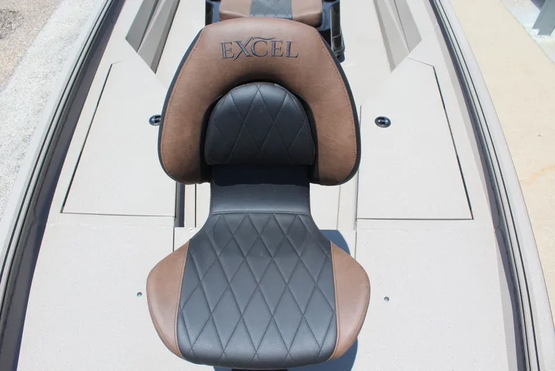 Slide: The Image of 2027 Excel 220 Bay Pro Elite boat seat with brown and black leather upholstery. - 17
