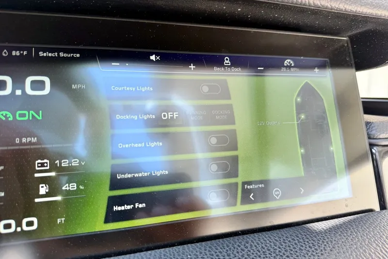 Slide: The Image of 2023 Nautique Super Air Nautique S23 dashboard display showing lighting and system controls. - 15