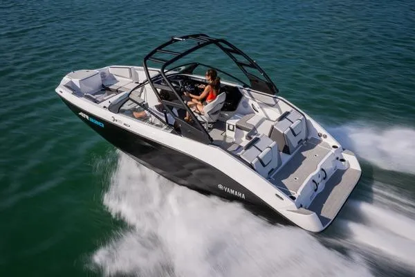 Slide: The Image of 2026 Yamaha Boats AR220 speeding on water, showcasing sleek design and modern features. - 3