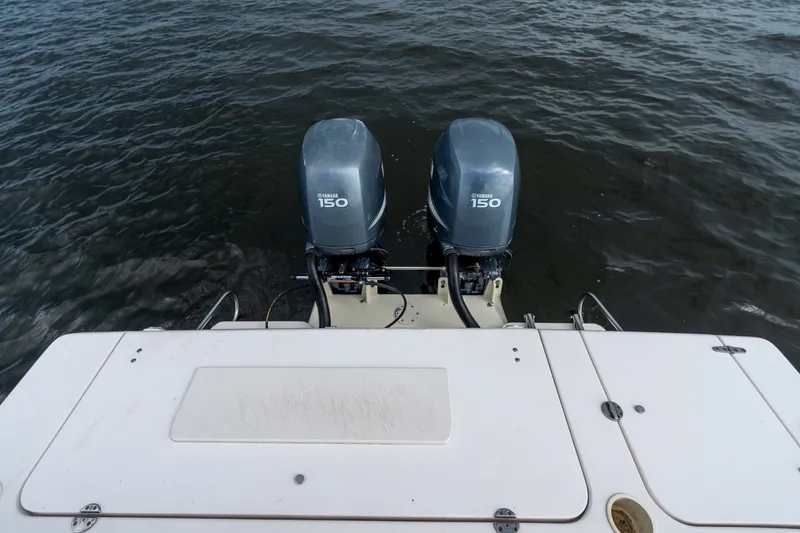 Slide: The Image of 2006 Grady-White Gulfstream 232 boat with twin Yamaha 150 engines on water. - 25
