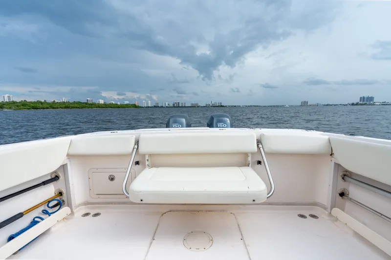 Slide: The Image of 2006 Grady-White Gulfstream 232 boat interior with ocean view and cloudy sky. - 20