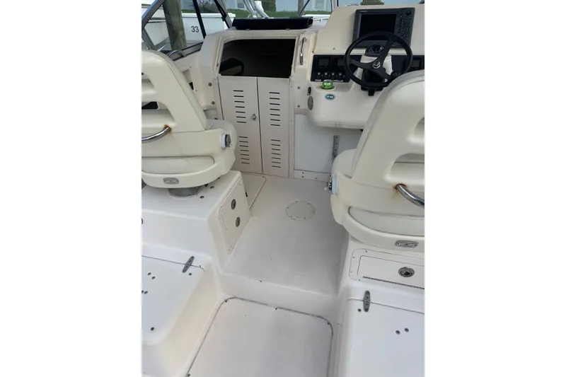 Slide: The Image of 2006 Grady-White Gulfstream 232 boat interior with helm and seating area. - 3