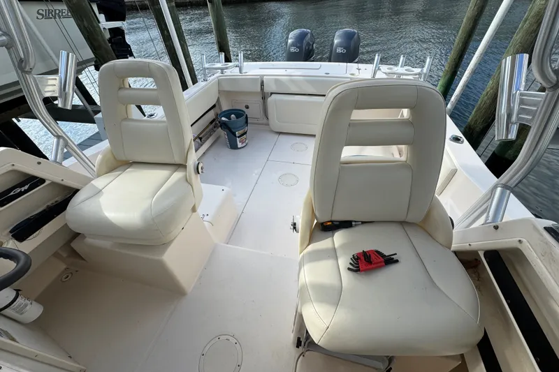 Slide: The Image of 2006 Grady-White Gulfstream 232 boat interior with seating and tools on deck. - 5