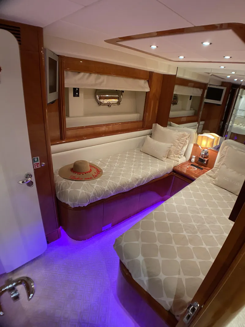 Slide: The Image of Luxurious cabin interior of 1999 Azimut 85 Ultimate yacht with twin beds and ambient lighting. - 41