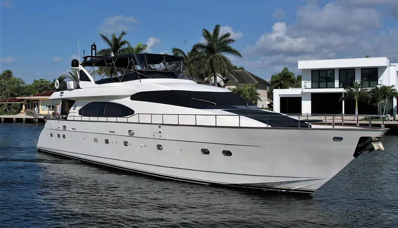 The Image of 1999 Azimut 85 Ultimate yacht cruising on a sunny day near waterfront homes. - 0