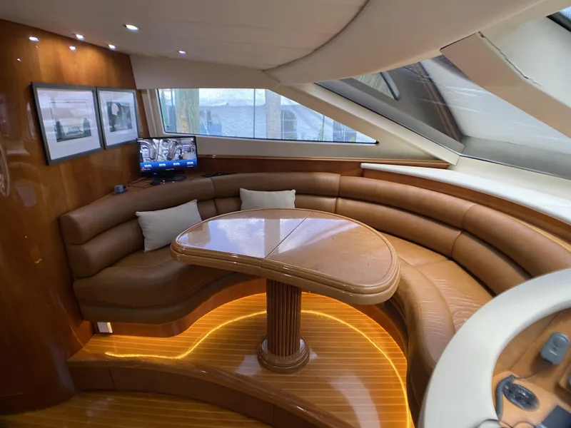 Slide: The Image of Luxurious interior of 1999 Azimut 85 Ultimate yacht with elegant seating and wooden table. - 32