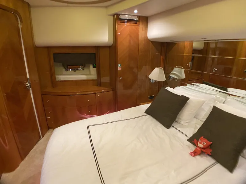 Slide: The Image of Luxurious bedroom interior of 1999 Azimut 85 Ultimate yacht with elegant wood finish. - 47