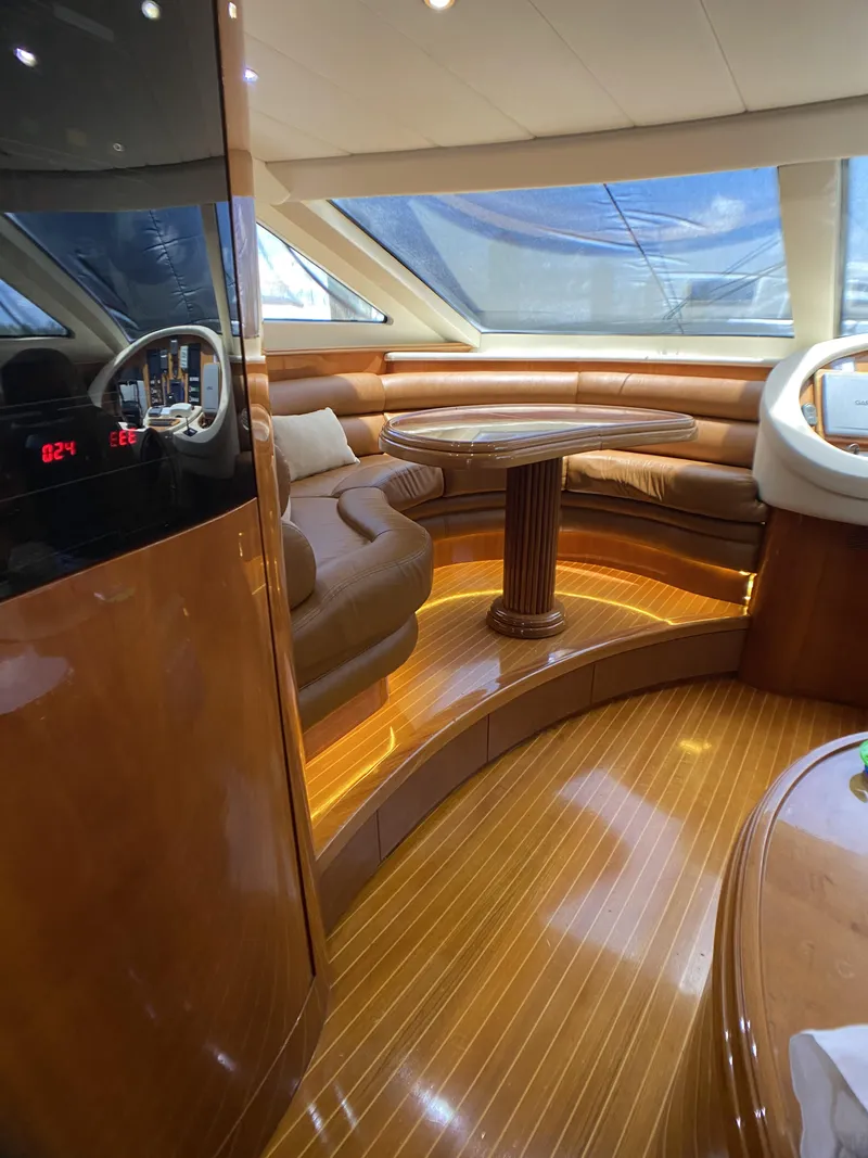 Slide: The Image of Luxurious interior of a 1999 Azimut 85 Ultimate yacht with elegant wood finishes. - 35