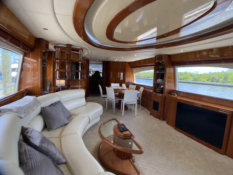Slide: The Image of Luxurious interior of a 1999 Azimut 85 Ultimate yacht with elegant furnishings and panoramic windows. - 4
