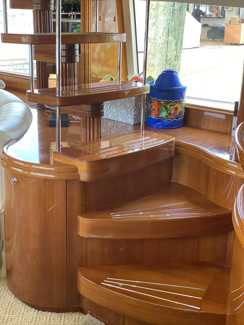 Slide: The Image of Interior of 1999 Azimut 85 Ultimate yacht with elegant wooden staircase design. - 17