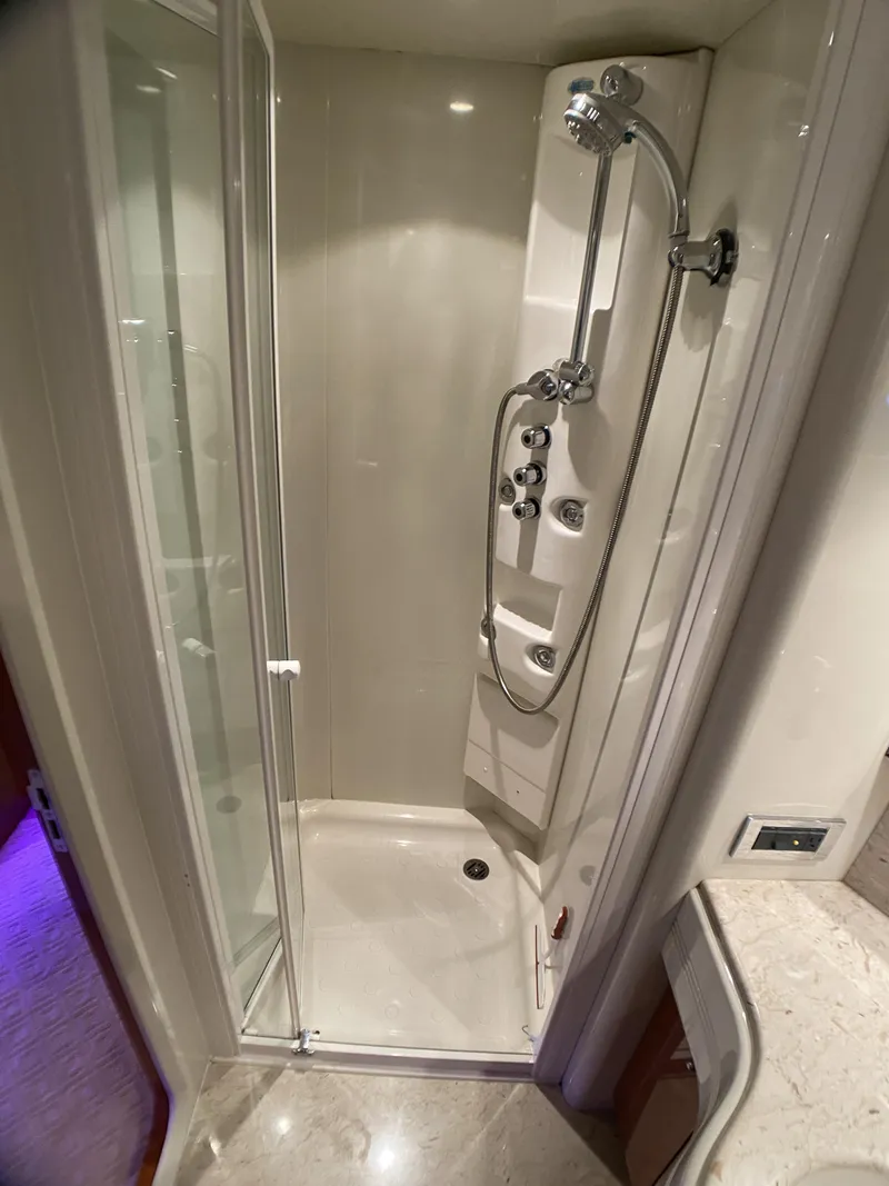 Slide: The Image of Shower area in 1999 Azimut 85 Ultimate yacht, featuring modern fixtures and glass door. - 42