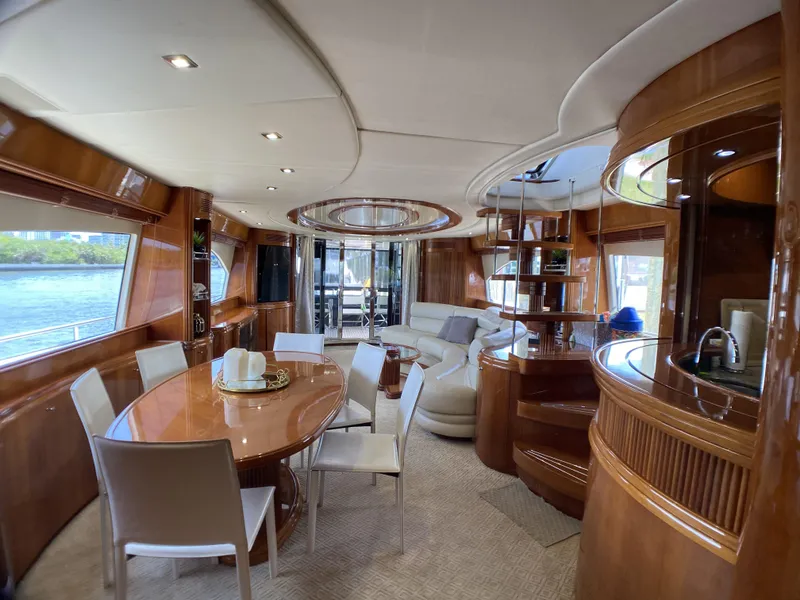 Slide: The Image of Luxurious interior of a 1999 Azimut 85 Ultimate yacht with elegant dining area and seating. - 10