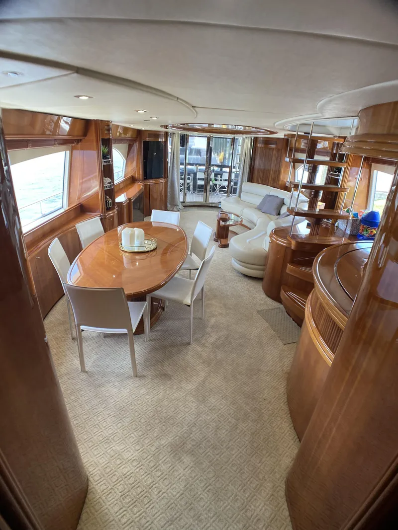 Slide: The Image of Luxurious interior of a 1999 Azimut 85 Ultimate yacht with elegant wood finishes. - 13