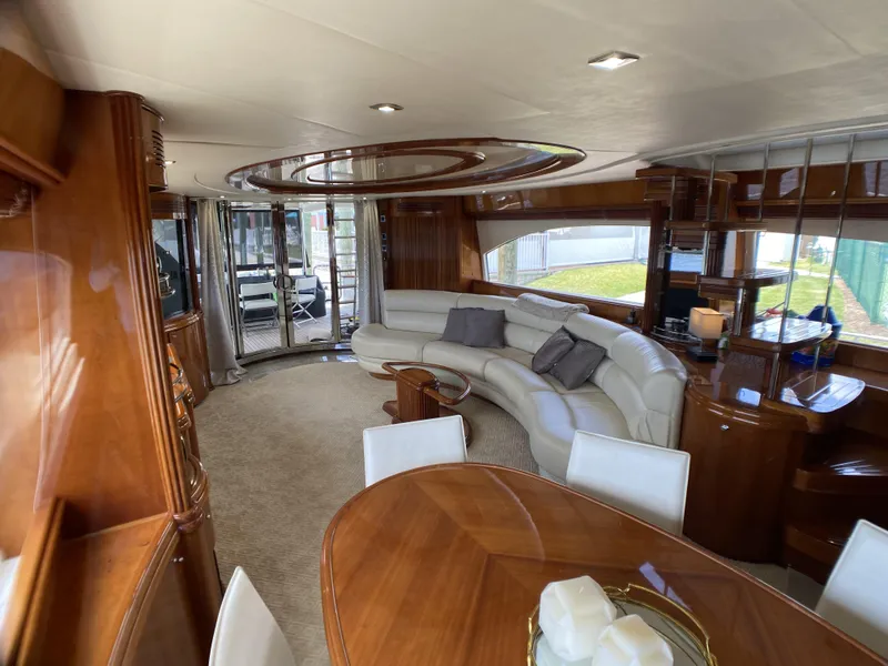 Slide: The Image of Luxurious interior of 1999 Azimut 85 Ultimate yacht with elegant wood and leather furnishings. - 15
