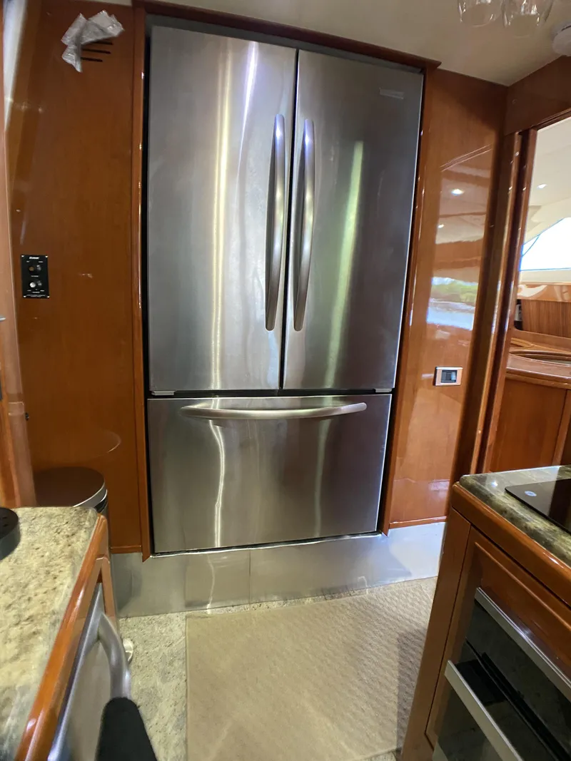 Slide: The Image of Stainless steel refrigerator in 1999 Azimut 85 Ultimate yacht kitchen interior. - 26