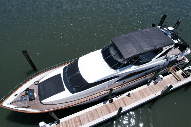 Slide: The Image of Aerial view of a 1999 Azimut 85 Ultimate yacht docked at a marina. - 2