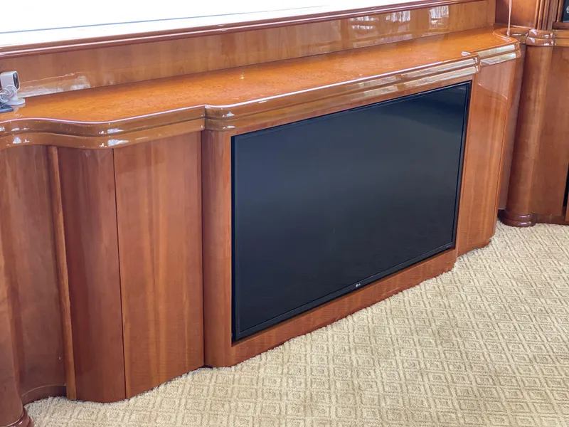 Slide: The Image of Luxurious wooden interior of 1999 Azimut 85 Ultimate yacht with built-in flat-screen TV. - 18