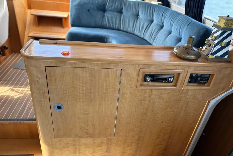 Slide: The Image of Interior of 2003 PDQ 34 Power Catamaran with wood paneling and blue seating. - 28