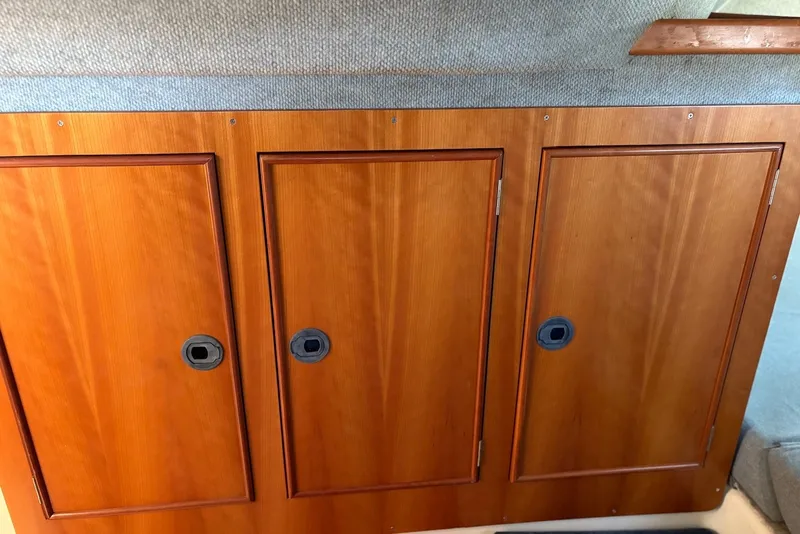 Slide: The Image of Wooden cabinetry on a 2003 PDQ 34 Power Catamaran interior. - 37