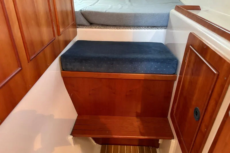 Slide: The Image of Wooden interior of 2003 PDQ 34 Power Catamaran with cushioned step and storage. - 35