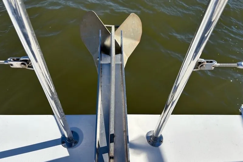 Slide: The Image of Anchor and railing on 2003 PDQ 34 Power Catamaran over water. - 17