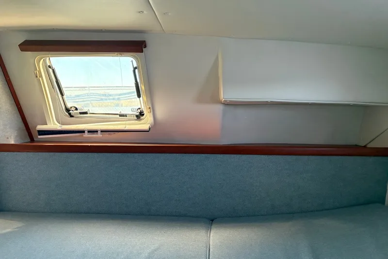 Slide: The Image of Interior cabin view of 2003 PDQ 34 Power Catamaran with window and seating. - 39