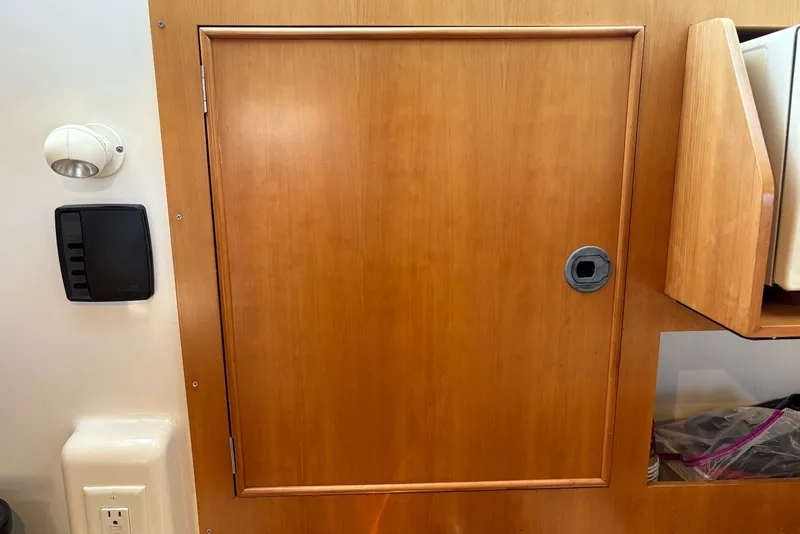 Slide: The Image of Wooden cabinet door on a 2003 PDQ 34 Power Catamaran interior. - 33